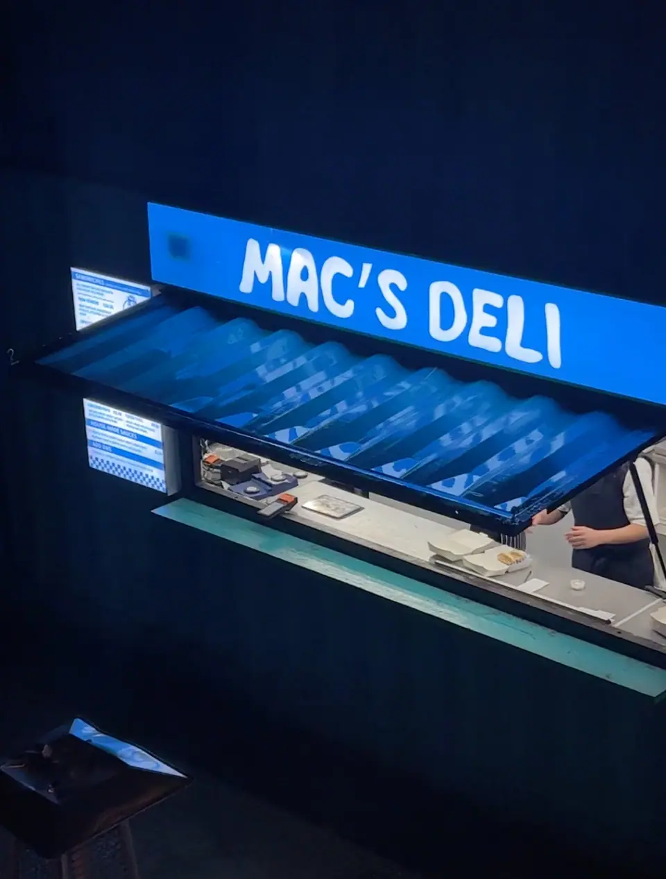 The lit-up Mac’s Deli counter at Blue Collar Corner in Reading